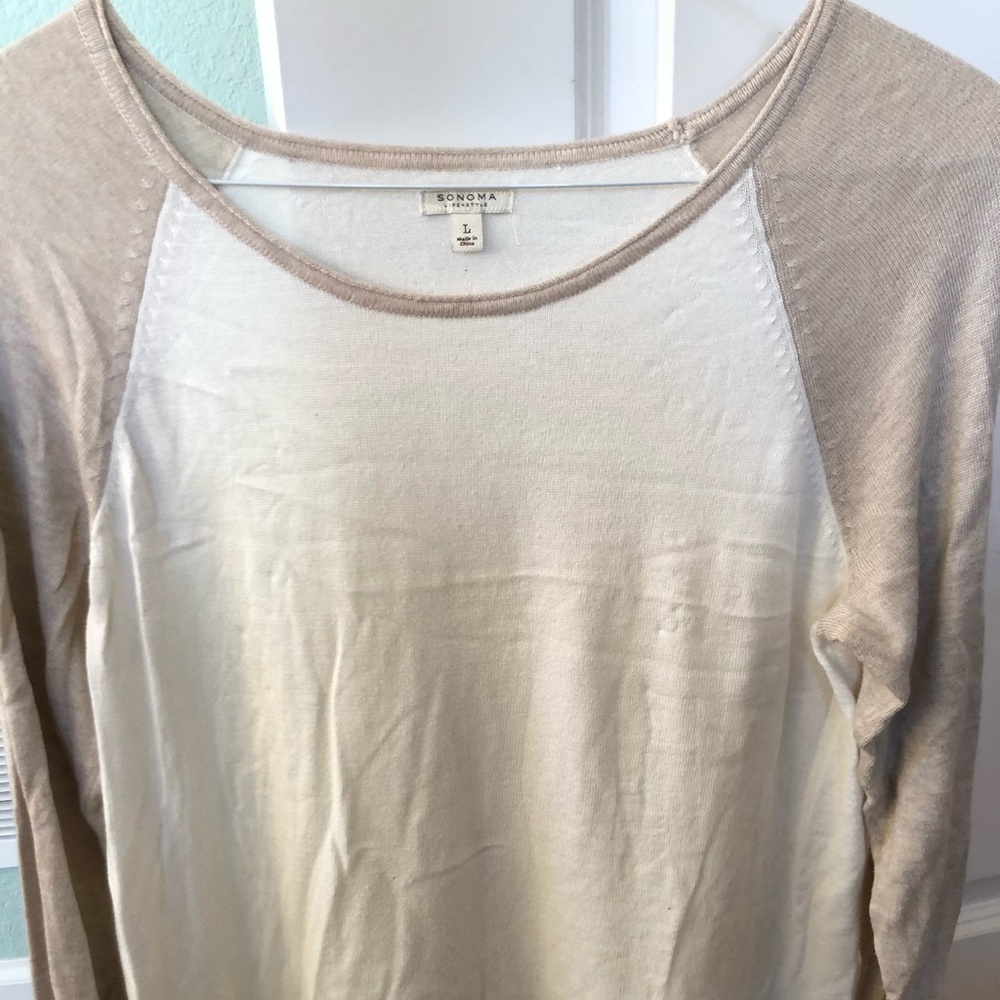Woman’s long sleeved knit top
